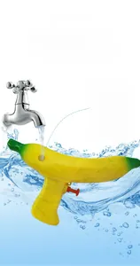 Banana water gun showing high-capacity tank with red plug and trigger on water ripple