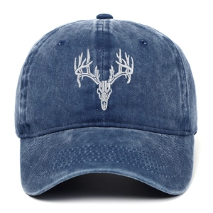 Adjustable washed cotton baseball cap with embroidered deer skull design in navy blue