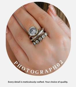 Macro shot of retro pearl and crystal ring set with detailed diamond pavé and vintage finish