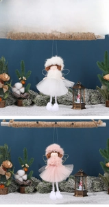 Detail of plush angel ornaments with gauze skirts and wings for Christmas tree decor
