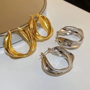 Modern minimalist twisted geometric hoop earrings in gold and silver finish