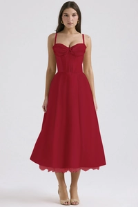 Detailed view of red floral summer dress with lace trim and corset-style bodice details