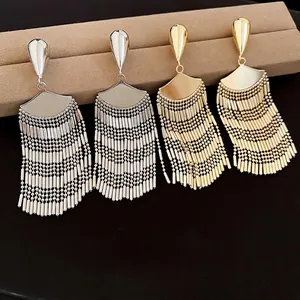 Elegant fan-shaped tassel earrings in gold and silver finish with cascading metal beads