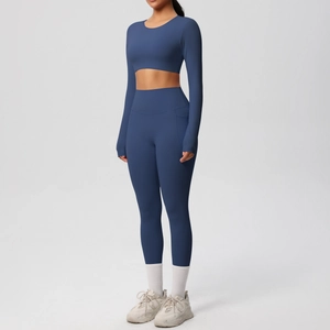 Close-up of navy blue long sleeve crop top and high waist yoga leggings with side pockets