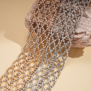 Elegant geometric rhinestone mesh necklace in gold and silver finish on textured stones