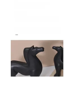 Detailed view of matte black Nordic horse sculptures with modern minimalist resin design