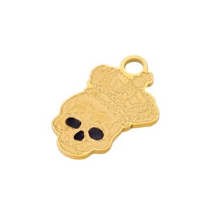 Detailed macro view of golden skull pendant with crown and black zircon eye accents