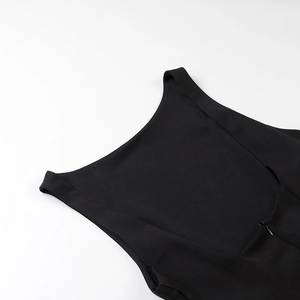 Detailed view of the ruffle halter neckline and premium fabric on this black mini dress
