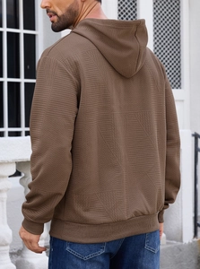 Detailed back view of men's brown hoodie featuring geometric jacquard waffle texture fabric