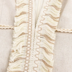 Robe longue bohème sans manches à col en V avec franges beige et texture en coton et lin
