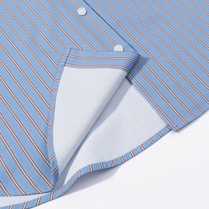Detailed close-up of sky blue striped fabric with fine brown lines and white buttons