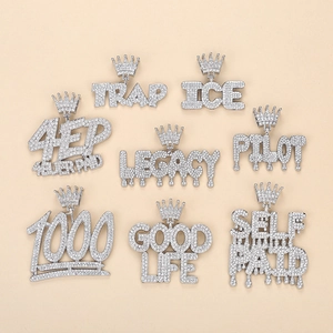 Detailed grid of silver iced-out hip hop pendants featuring creative letter and number designs