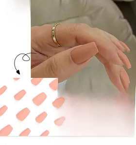 Detail view of matte nude pink short ballerina press-on nails with French style design