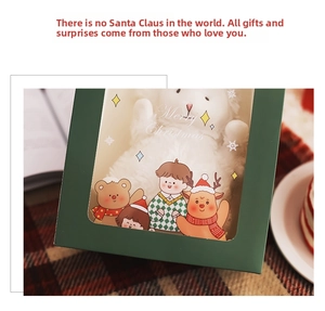 Close-up of a Christmas gift box with a plush white rabbit and a Merry Christmas window