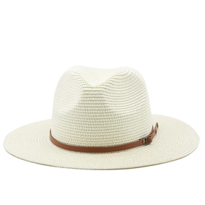 Close-up of woven straw hat featuring detailed texture and brown leather hat band