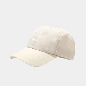Detail view of the multi-row stitching on the brim and quick-dry nylon fabric of the cap