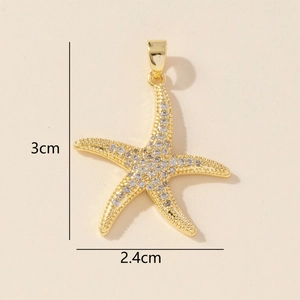 Macro shot of gold-plated starfish pendant with clear cubic zirconia and size dimensions