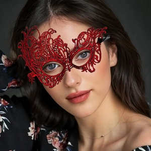 Detailed view of red lace phoenix mask with intricate floral embroidery and silk straps