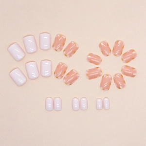 Short white press-on nails with floral patterns and gold foil flakes for girls