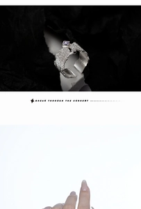 Macro detail of silver ring with rock texture, purple gemstone and side diamond