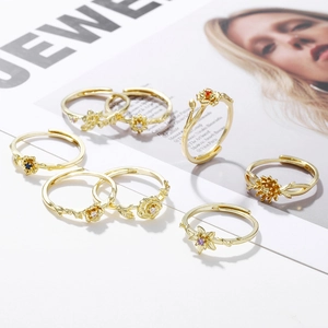 Detail of adjustable gold floral rings with colorful zircon crystals on jewelry magazine