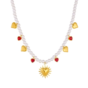 Elegant gold pearl necklace with red heart and sun pendants on a clean white background