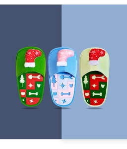 Detailed view of three colorful Christmas slipper snuffle toys for dogs with festive patterns