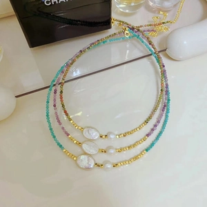 Three-piece layered gemstone and freshwater pearl beaded necklace set with gold accents