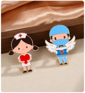 Detailed view of enamel nurse and doctor badges on elegant gold silk and wood background