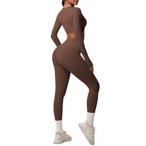 Brown two-piece yoga set with long sleeve crop top and high waist leggings