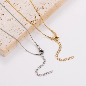 Minimalist hollow heart necklace in gold and silver stainless steel snake chain design