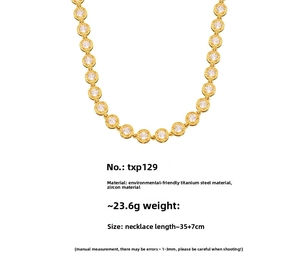 Detail of 18k gold plated titanium steel necklace with zircon pavé links and specs