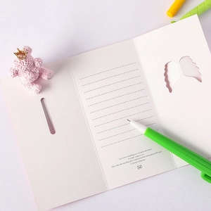 Pink heart-shaped 3D greeting card with cute stationery and handwritten quote