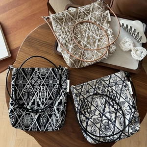 Retro embroidered canvas crossbody bag with bird patterns and slim leather strap