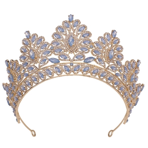 Baroque bridal crown with blue gemstones and gold base for wedding hairstyles
