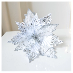 Close-up of glittery silver Christmas flower decoration with sparkling sequin details