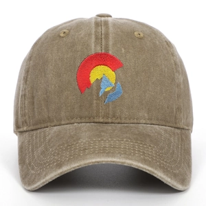 Close-up of Colorado flag mountain embroidery on washed khaki cotton baseball cap