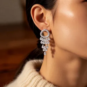 Silver drop earrings with sparkling zirconia tassels in a layered pear-shaped design