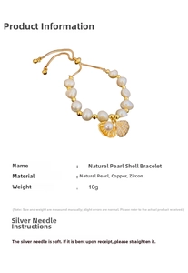 Detail of natural baroque pearl bracelet with gold shell pendant and zircon inlay