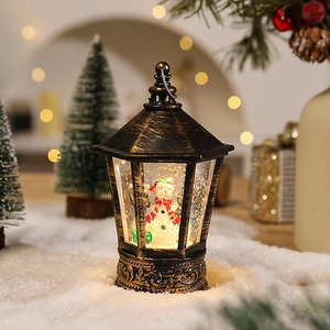 Close-up of vintage bronze Christmas lantern with a snowman scene and festive bokeh lights