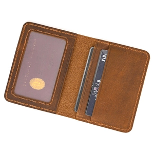 Detailed interior of brown crazy horse leather card holder with clear ID slot and card slots