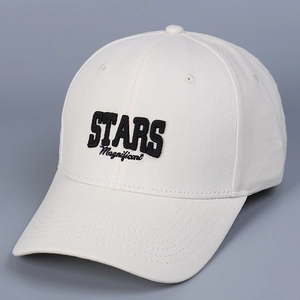 Detail of cream cotton baseball cap with bold black Stars embroidery and fine stitching