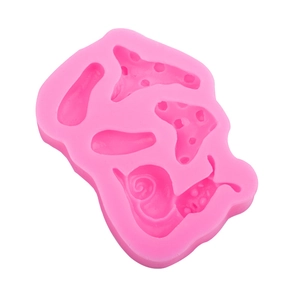 Pink silicone fondant mold featuring snail and mushroom shapes for forest cake decorating