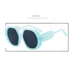 Detail of light blue matte oversized square sunglasses with dark polarized lenses