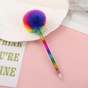 Rainbow gradient candy colored plush ball point pen on a decorative pink desk setting