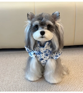 Detail of pet floral vest with flutter sleeves and snap buttons for small dogs and cats