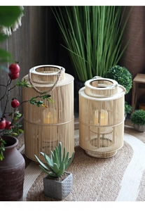 Close-up of hand-woven bamboo lanterns with hemp rope handles in a cozy home setting