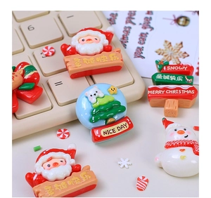 Close-up of resin Christmas keycaps with Santa and snowman on mechanical keyboard