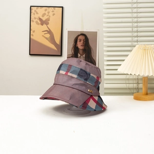 Women's foldable sun hat with checkered band and metallic accent on purple-grey fabric