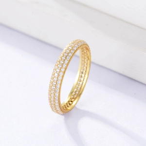 Macro shot of 925 silver gold-plated ring with triple-row micro-pave cubic zirconia
